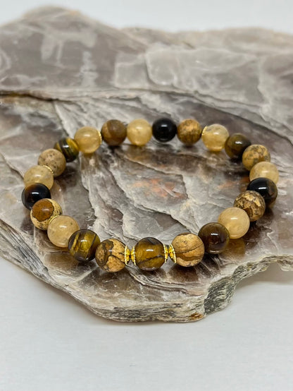 CR Golden | Olho de Tigre, Jaspe Madeira e Quartzo Rutilado – Proteção, Estabilidade e Crescimento Espiritual (Banho Ouro 18K)